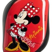 Punainen hiiren muotoinen esine, jossa Minnie Mouse -logo ja hahmo, pilkullinen rusetti ja keltaiset kengät.