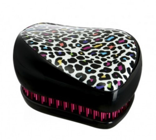 A small, black hairbrush with a colorful leopard print top and pink bristles inside.