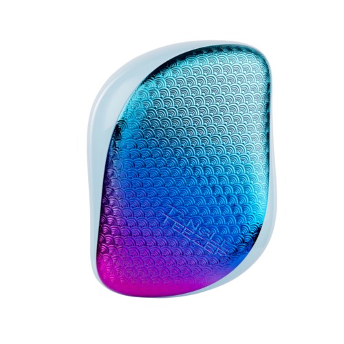 A small, colorful wireless speaker with a blue to purple gradient and wave pattern on its surface.
