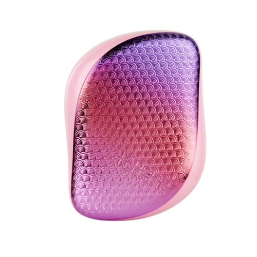 A pink and purple oval makeup mirror with a textured surface inside.