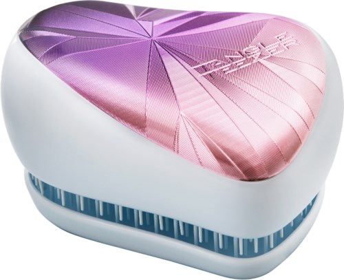 Sydämen muotoinen meikkilasi, jossa on violetti ja pinkki kuvio kansiossa ja valkoinen pohja.