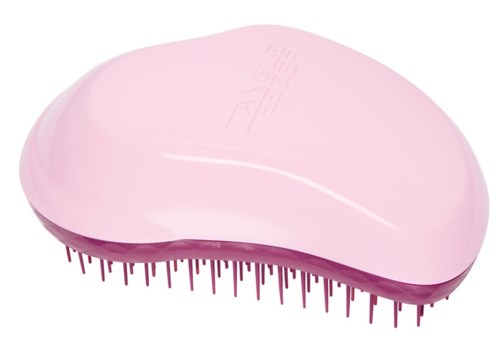 A pink hairbrush with many short, thin bristles and a curved shape.