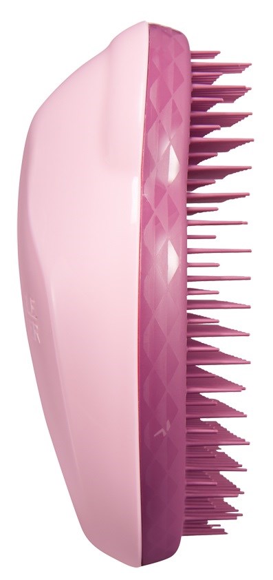 A pink hairbrush with a curved handle and many straight bristles. The brush has a checkered pattern on one side.