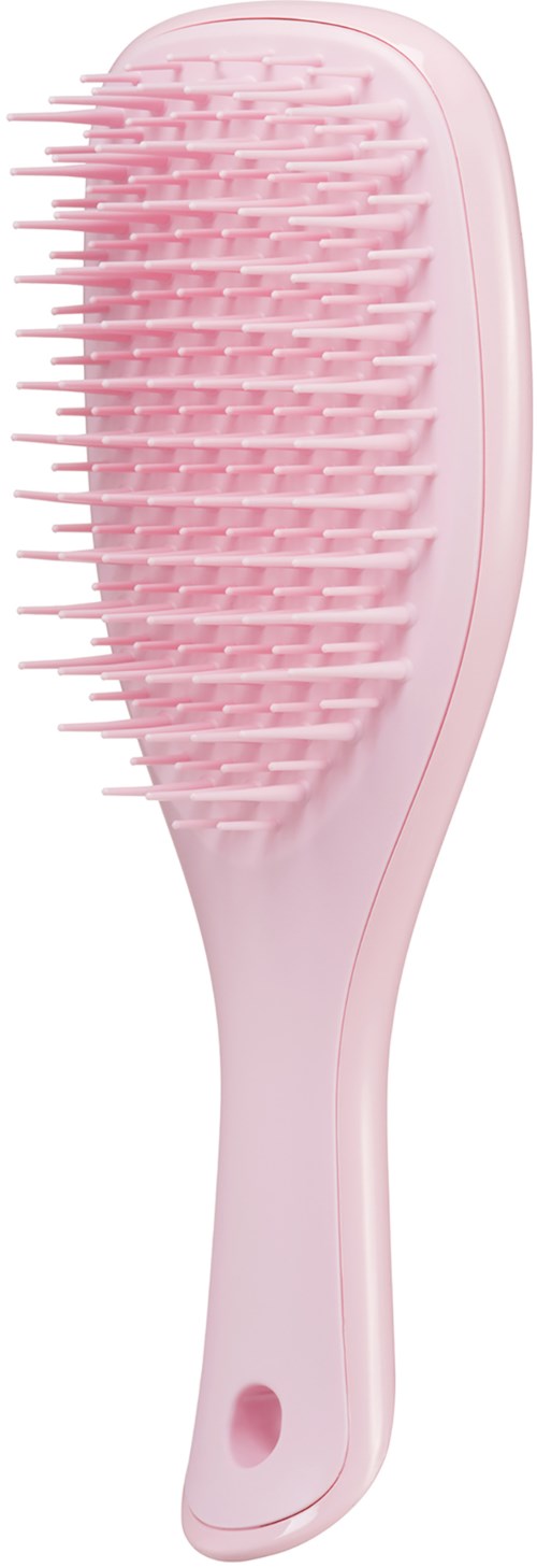 Eine pinke Haarbürste mit breiten, flexiblen Borsten und einem Loch am Griff.