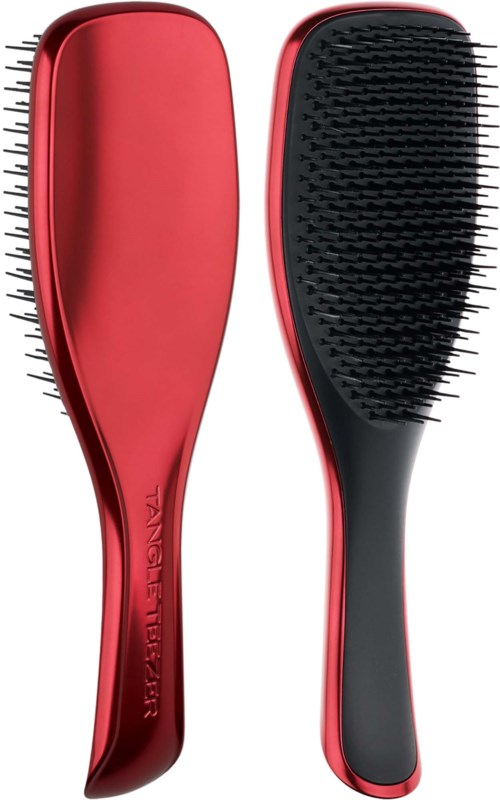 A red and black hairbrush with plastic bristles, one side smooth and the other side textured.