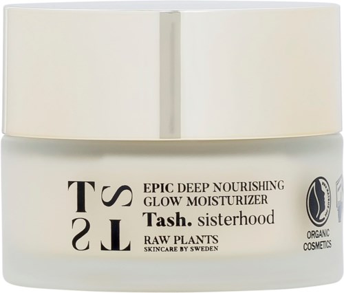 En vit burk av Tash sisterhood glow moisturizer med svart text och logo för organiska kosmetika.