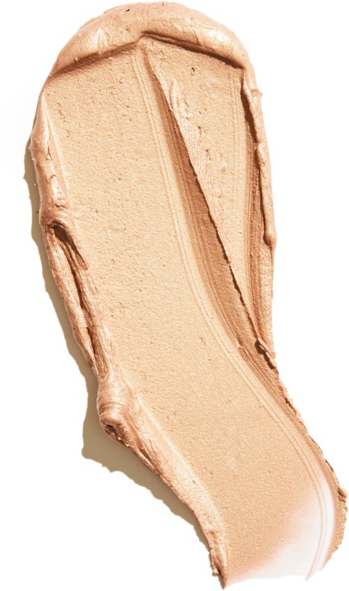En beige, slät, kurvad färgprov av makeup eller foundation med texturerade kanter.