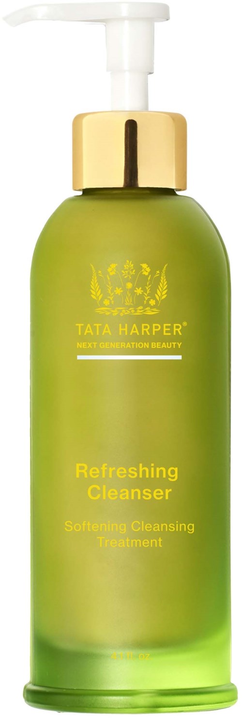 Green bottle with a white pump, gold cap, and yellow label. It is Tata Harper Refreshing Cleanser. The label says it softens and cleanses.