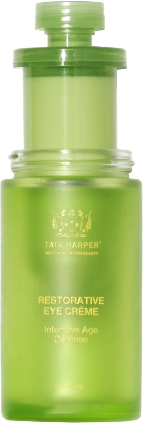 En grønn flaske med Tata Harper Restorative Eye Crème for aldrende hud. Den har en pumpe og en klar beholder.