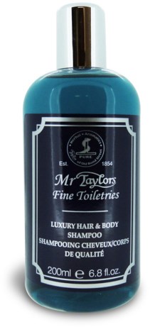 En blå flaske med Mr. Taylor's Fine Toiletries sjampo med svart kork og hvit og svart etikett.