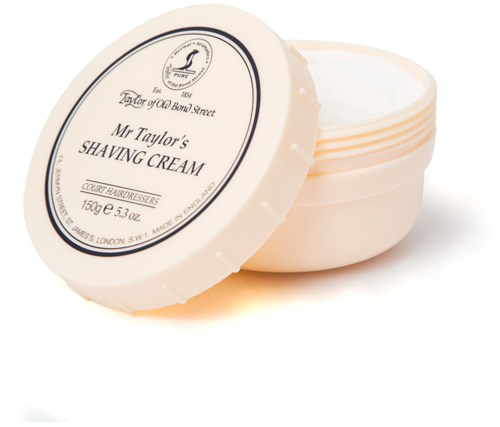 En rund behållare med lock, märkt 'Mr. Taylor's Shaving Cream', med logo och produktinformation.