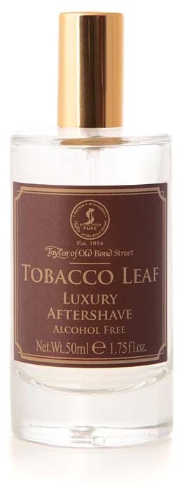 En klar flaska med guldkapsel innehåller Tobacco Leaf Luxury Aftershave, alkolfri, 50 ml.