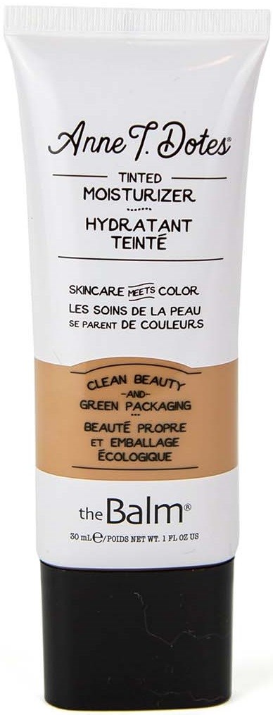 En tube med tonet fugtighedscreme fra Anne F. Dotes fra The Balm, hvid og sort med brunt område og produktdetaljer.
