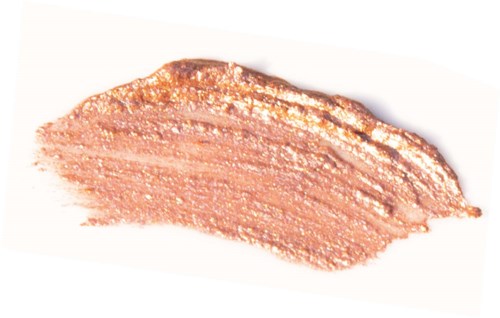En stribe af glitrende, lyserød-beige makeup eller kosmetisk creme.