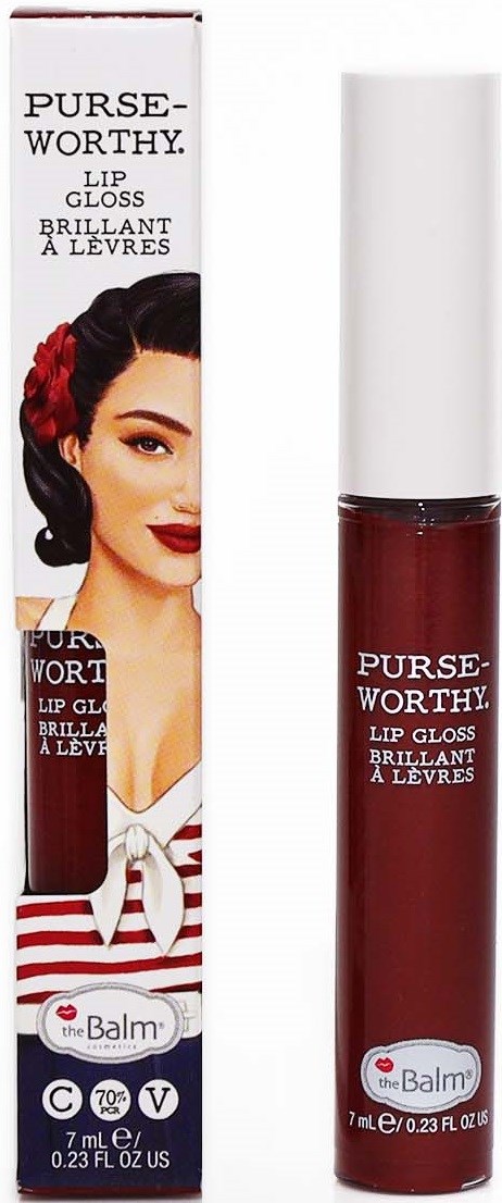 En læbepomade kaldet PursWorthy fra the Balm med retro stil og en kvinde i vintage makeup på boksen.