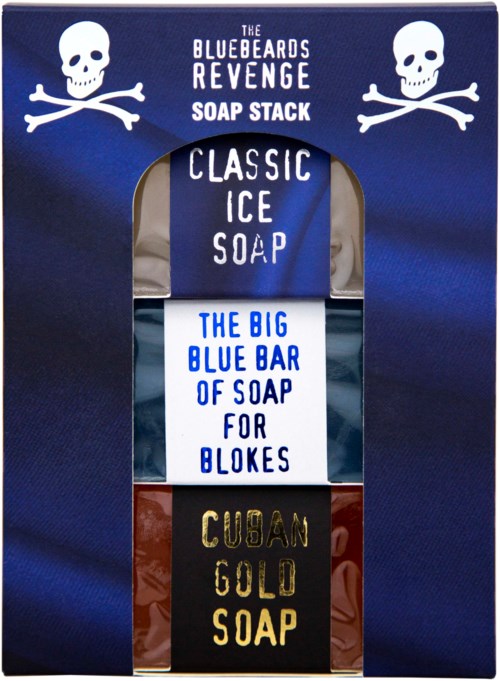 A navy blue box contains three soap bars, each with distinct names and designs, labeled as part of a revenge-themed set.