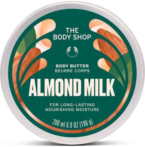 Rund beholder med almond milk kroppssmør fra The Body Shop med grønn og oransje bladdesign.