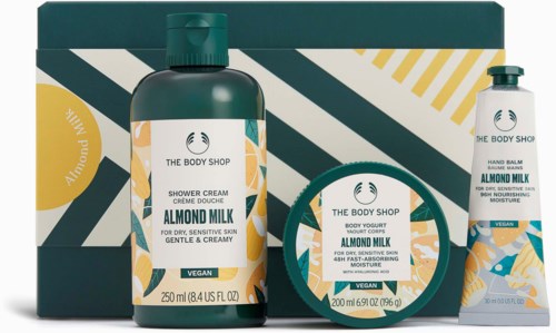Three skincare products from The Body Shop: shower cream, hand balm, and body butter, all almond milk flavor.
