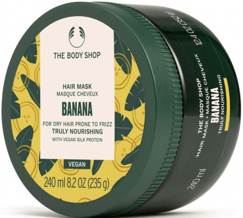 Vihreä ja keltainen The Body Shop -rasia banaanihiusnaamio kuivaan hiukseen. Sisältää vegaanista silkkiproteiinia.