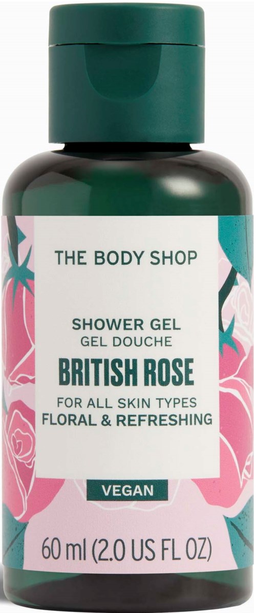 En flaske med dusjsåpe med rosa roser og grønne blader på etiketten, teksten viser at den er vegan og floral.