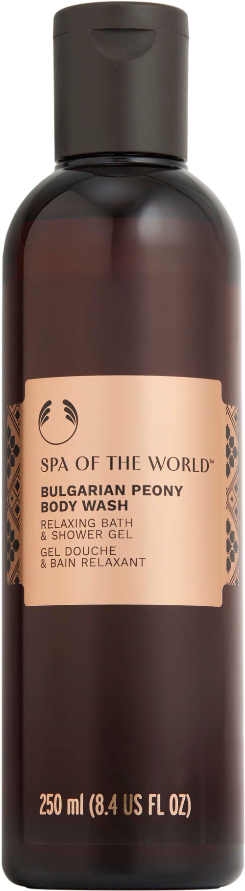 Długa, ciemno-brązowa butelka z etykietą mówiącą 'Spa of the World Bulgarian Peony Body Wash.'