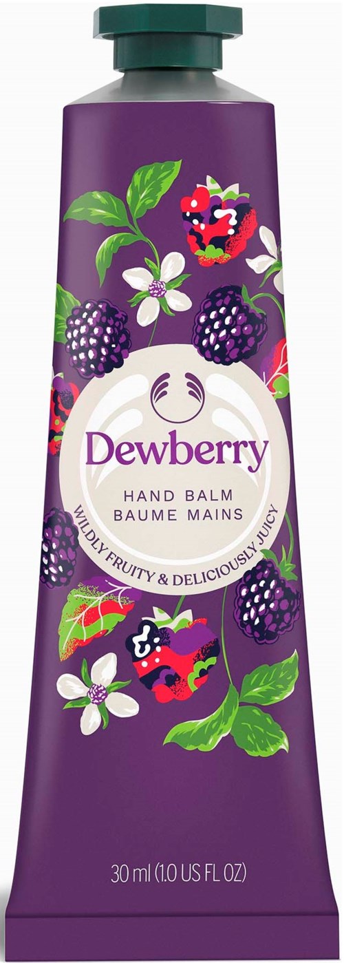 En lila handkrämstub som är dekorerad med björnbär, äpple och blommor för fruktig doft.