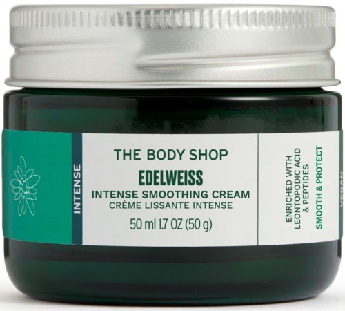 En grønn krukke med The Body Shop Edelweiss intensjonsfuktighetskrem med hvit lokk og etikett.