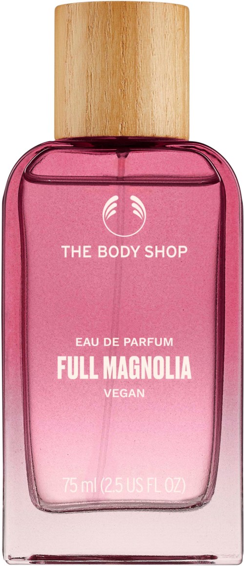 Rosa parfymeflaske med et trebunnlokk, merket 'The Body Shop,' 'Full Magnolia' og 'Vegan,' med 75 ml.