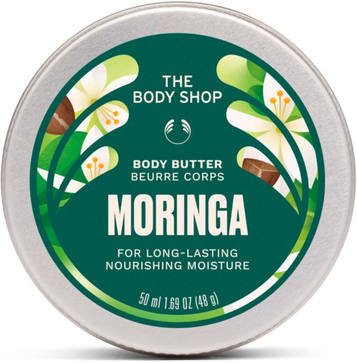 Rund beholder med grønn etikett som viser hvite blomster, tekst for kroppsbutter, og en størrelse på 50 ml fra The Body Shop.