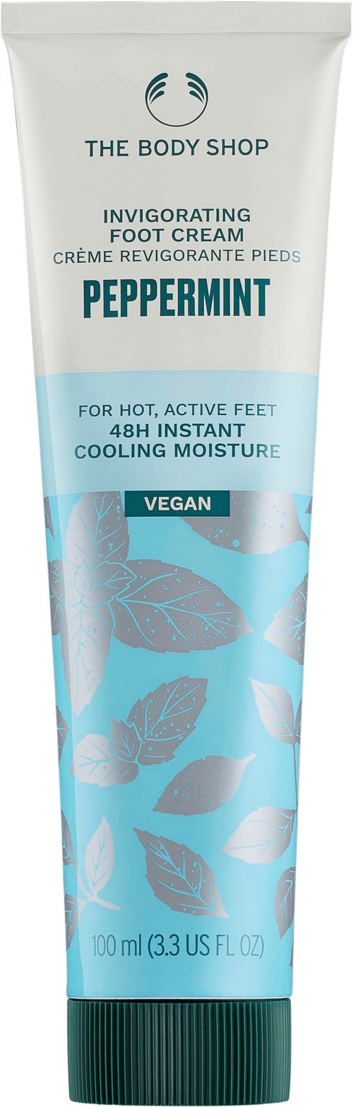 A white and light blue tube of peppermint foot cream by The Body Shop, labeled vegan and for heated, active feet.