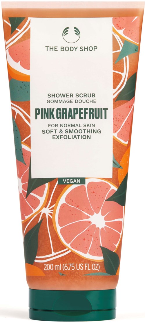 En tub med rosa grapefrukt duschskrubb med färgglada frukt- och bladmönster, märkt som vegansk och lämplig för normal hud.