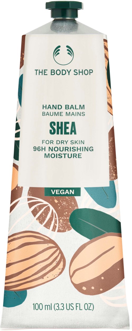 En tube av The Body Shop Shea håndbalm, vegansk, for tørr hud, 100 ml, med blad- og nøtteillustrasjoner.