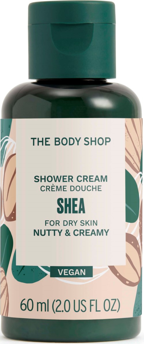 Eine dunkelgrüne Flasche mit Duschcreme von The Body Shop, für trockene Haut mit Shea und vegan.