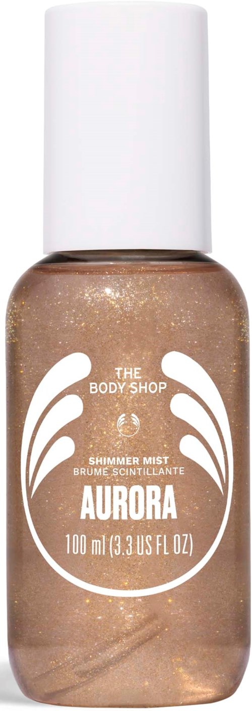 En liten flaska med skimrande spray som heter Aurora från The Body Shop, med vit kork och gyllene glittrande vätska.