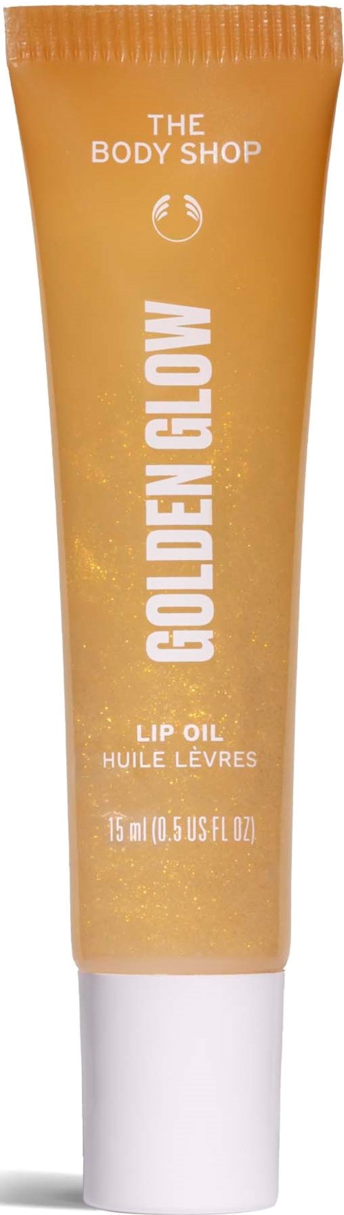 Een kleine fles lipolie van The Body Shop met gouden kleur en witte dop.