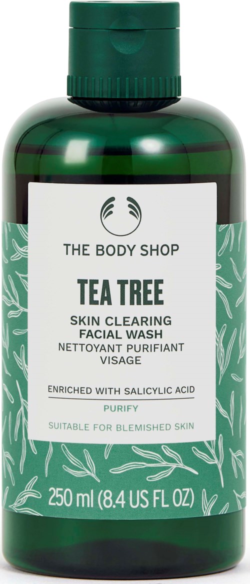 Green bottle of Tea Tree facial wash with label text and leaf design, 250ml. Suitable for blemished skin.