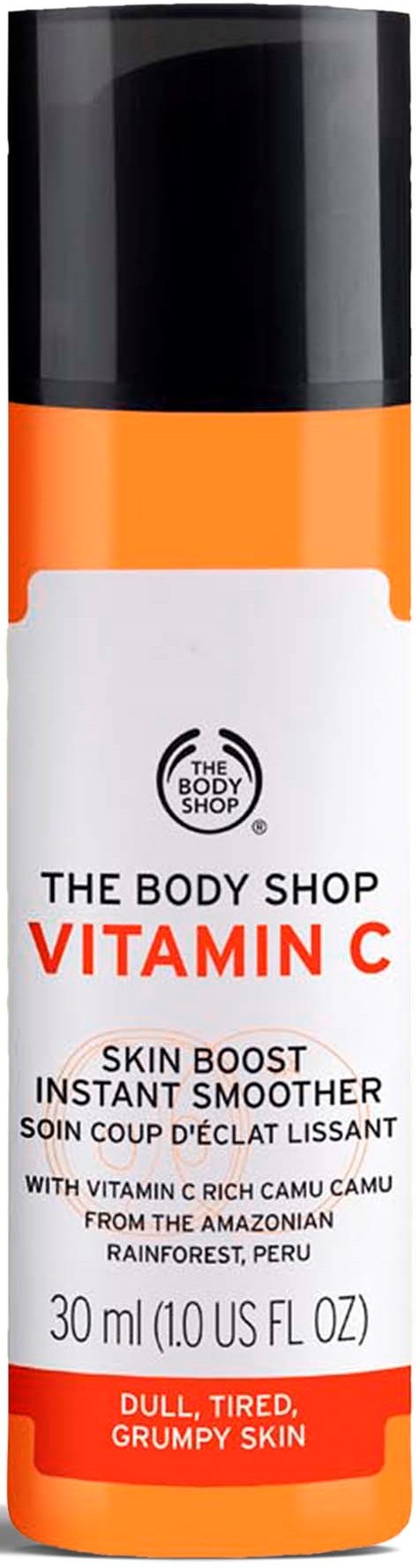 En hvit og oransje flaske med The Body Shop Vitamin C hudforsterker for trett, grumpy hud fra Peru.