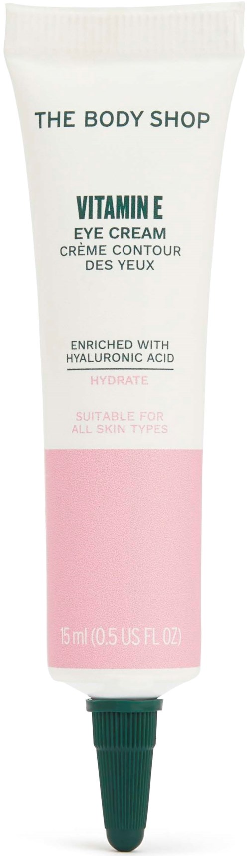 En hvid og pink tube af The Body Shop Vitamin E Eye Cream med grøn kapsel. Indeholder hyaluronsyre for hydratation.