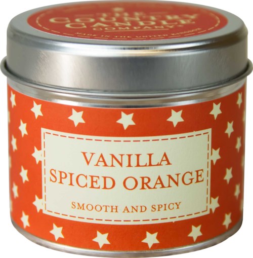 En liten metallburk märkt 'Vanilla Spiced Orange' med stjärnor, som antyder en doftprodukt som ett ljus eller kryddburk.