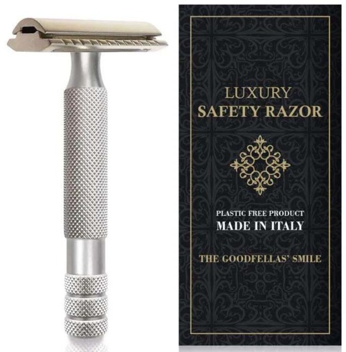 Ein silberner Sicherheitsrasierer mit strukturiertem Griff und einer dunklen, dekorativen Box, die "Luxury Safety Razor" sagt.