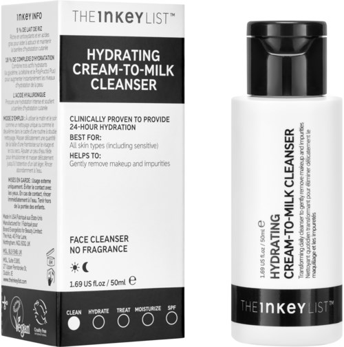 Valkoinen pullo mustalla kannella ja sen vieressä pahvipakkaus, merkintä Hydrating Cream-to-Milk Cleanser kaikkialle ihotyypeille.