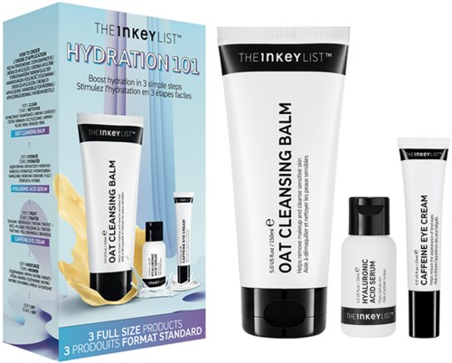 A skincare set with oat cleansing balm, eye cream, and serum, in a box and tubes, designed for hydration and skin care.
