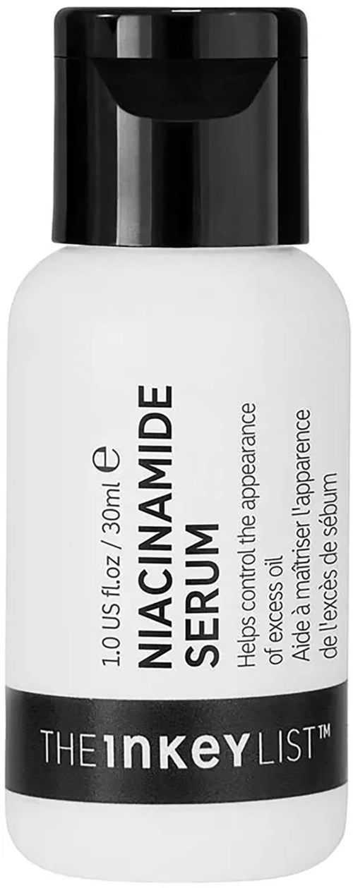 En hvit flaske med svart lokk som inneholder Niacinamide serum for hudhelse og utseende.