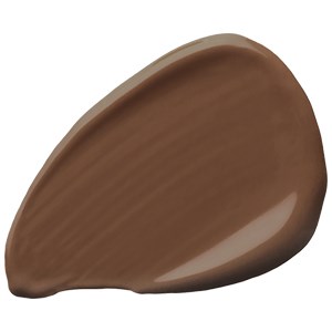 En slät, brun, tårformad sak med glänsande yta. Det verkar vara en bit choklad eller en nöt.