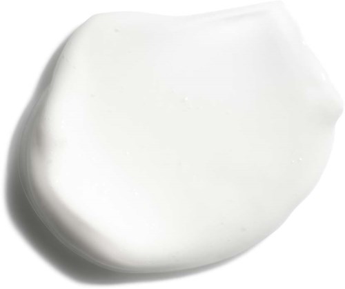 A blob of white cream on a white background, smooth and thick, with slight curves on the edges.