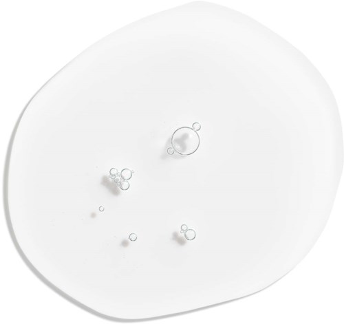 Små bubblor på en vit yta, flytande och samlade.