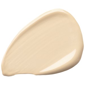 En beige, tårfadsformad sak med slät, glänsande yta. Den liknar ett skal eller en keramikkorv.
