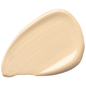 En stor, krämfärgad, tårformad klick av lotion eller kräm.