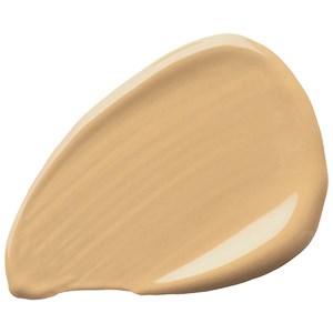 En beigefärgad tandkrämsremsa med en blank, slät yta och en rund form.