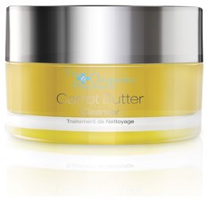 Gult glas med ett silverlock märkt 'Carrot Butter' för hudvård.